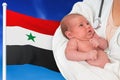 Birth rate in Syria. Newborn baby in hands of doctor