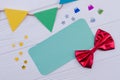 Birthday accessories on white wooden background. Royalty Free Stock Photo