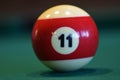 The number eleven ball on pool table Royalty Free Stock Photo