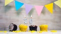 Birthday background with number 20. Beautiful birthday card with colorful garlands, a muffin with a candle burning copyspace. Royalty Free Stock Photo