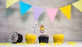 Birthday background with number 78. Beautiful birthday card with colorful garlands, a muffin with a candle burning copyspace. Royalty Free Stock Photo