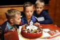 Birthday boy blows out candle Royalty Free Stock Photo