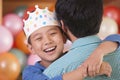 Birthday Boy Hugging His Father Royalty Free Stock Photo