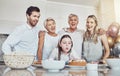 Birthday, cake and big family with girl blowing out candles for wish, party or celebration event. Love, food and kid Royalty Free Stock Photo