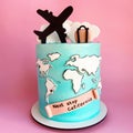 Birthday cake, blue, decorated with an airplane, suitcase, clouds, world map and written: Next Stop California Royalty Free Stock Photo