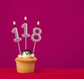 Birthday cake with candle number 118 - Rhodamine Red foamy background