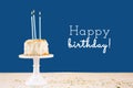 Birthday cake with candles on classic blue with Happy birthday wording. Birthday party celebration concept Royalty Free Stock Photo