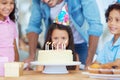 Birthday cake candles, kids party celebration and happy children, friends group or family celebrate childhood memory Royalty Free Stock Photo