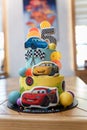 Birthday cake with cars illustration. Cartoon character cake for child party. Thematic event Royalty Free Stock Photo