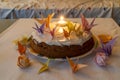 Birthday cake decorated with origami, in solitude without people Royalty Free Stock Photo