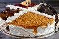 A birthday cake, four different quarters spongy creamy cake for celebrations, biscuits and cream, hazelnut chocolate spread,