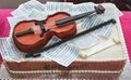 Birthday cake for a girl with a violin and notes. Musical concept