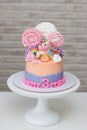 Birthday cake for a little girl with cute fondant fondant unicorn, flowers and rainbow