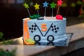 Birthday cake with mastic stars and cars figures for boy. 5 years old