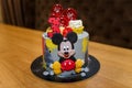 Birthday cake with Mickey Mouse cartoon character. Thematic Walt Disney event for 3 years old child