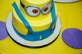 Birthday cake in minion shape. Cartoon character cake for child party. Thematic event. Candy bar