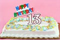 Birthday Cake with Number 13 Lit Candles Royalty Free Stock Photo
