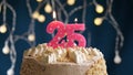 Birthday cake with 25 number pink candle on blue backgraund