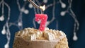 Birthday cake with 7 number pink candle on blue backgraund. Candles are set on fire Royalty Free Stock Photo