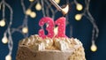 Birthday cake with 31 number pink candle on blue backgraund. Candles are set on fire Royalty Free Stock Photo