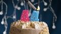 Birthday cake with 44 number pink candle on blue backgraund. Candles are set on fire Royalty Free Stock Photo