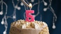 Birthday cake with 5 number pink candle on blue backgraund. Candles are set on fire Royalty Free Stock Photo