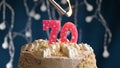 Birthday cake with 70 number pink candle on blue backgraund. Candles are set on fire Royalty Free Stock Photo