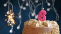 Birthday cake with 6 number pink candle and sparkler on blue backgraund Royalty Free Stock Photo