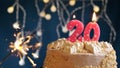 Birthday cake with 20 number pink candle and sparkler on blue backgraund Royalty Free Stock Photo