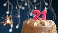 Birthday cake with 21 number pink candle and sparkler on blue backgraund Royalty Free Stock Photo