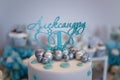 Birthday cake for a one year old boy. Silver and blue baubles decorations of mastic. Candy bar. Royalty Free Stock Photo