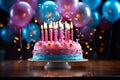Birthday cake with pink and blue frosting and lit candles Royalty Free Stock Photo