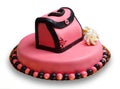 Birthday cake with pink frosting,decorated handbag Royalty Free Stock Photo