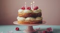 Birthday Cake With Pink Icing and Lit Candles Royalty Free Stock Photo