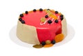 Birthday cake with red icing and berrys isolated over white Royalty Free Stock Photo
