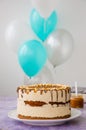 Birthday cake. Snickers homemade holiday cake with caramel, nougat, peanuts and chocolate. Royalty Free Stock Photo