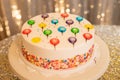 Birthday cake with sprinkles and streamers Royalty Free Stock Photo