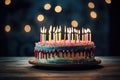 a birthday cake with unlit candles on a table Royalty Free Stock Photo