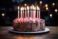 a birthday cake with unlit candles on a table Royalty Free Stock Photo