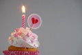 Birthday cake with whipped cream and sugar sprinkles