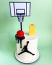 Birthday cake, white decorated with basketball motifs, basket, t-shirt, player, isolated