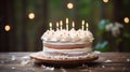 A birthday cake with white frosting and lit candles Royalty Free Stock Photo