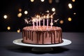 a birthday cake on a white plate with a sparkler on the side Royalty Free Stock Photo