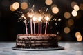 a birthday cake on a white plate with a sparkler on the side Royalty Free Stock Photo