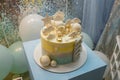 Birthday cake for 1 year old baby boy. Cake with star, clouds toppers, balls, teddy bear and ladder Royalty Free Stock Photo