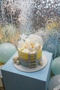 Birthday cake for 1 year old baby boy. Cake with star, clouds toppers, balls, teddy bear and ladder Royalty Free Stock Photo