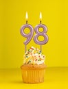 Birthday candle number 98 - Invitation card with yellow background