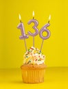 Birthday candle number 136 - Invitation card with yellow background