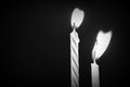 Birthday candles against a dark background close-up. Black and white