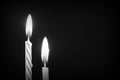 Birthday candles against a dark background close-up. Black and white